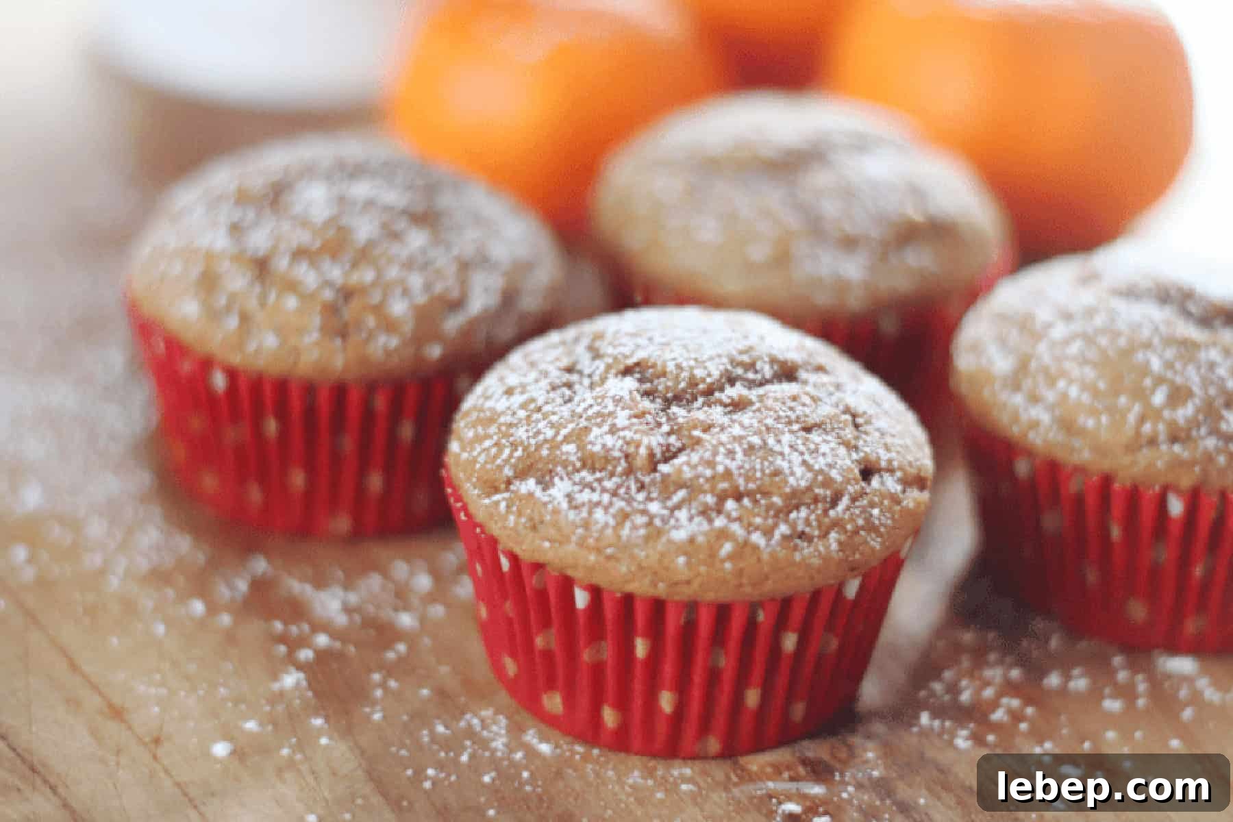 Gingerbread Muffins Recipe with Warm Spices and Molasses 6 Gingerbread muffins in red muffin liners.