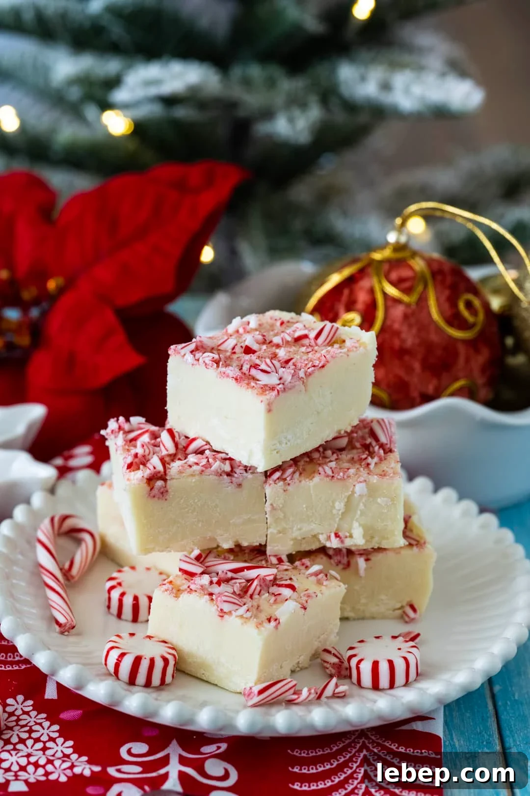 Fudge on a plate and Christmas decorations in background.