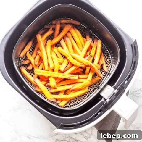 Put sweet potato fries in the Air Fryer and cook them crispy. These Air Fryer frozen sweet potato fries are done in less than 15 minutes. Golden brown and crispy. They are a great side dish you can serve with any main dish. Want to try? Visit fastfoodbistro.com for the full recipe and instructions
