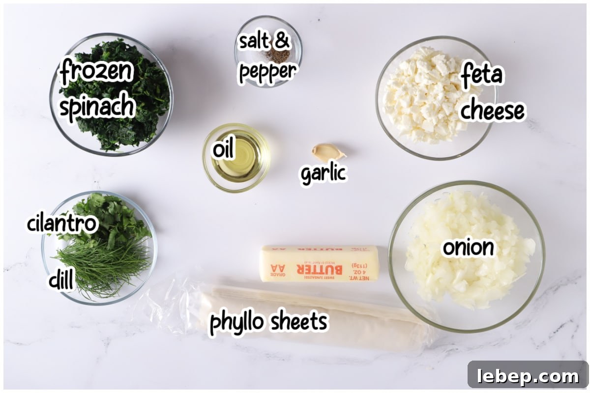 Ingredients for the spanakopita recipe with text overlay.