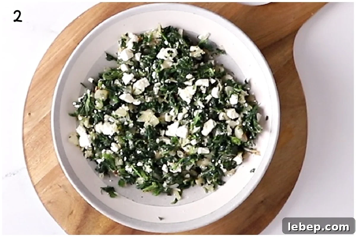 A large bowl with spinach feta mixture.