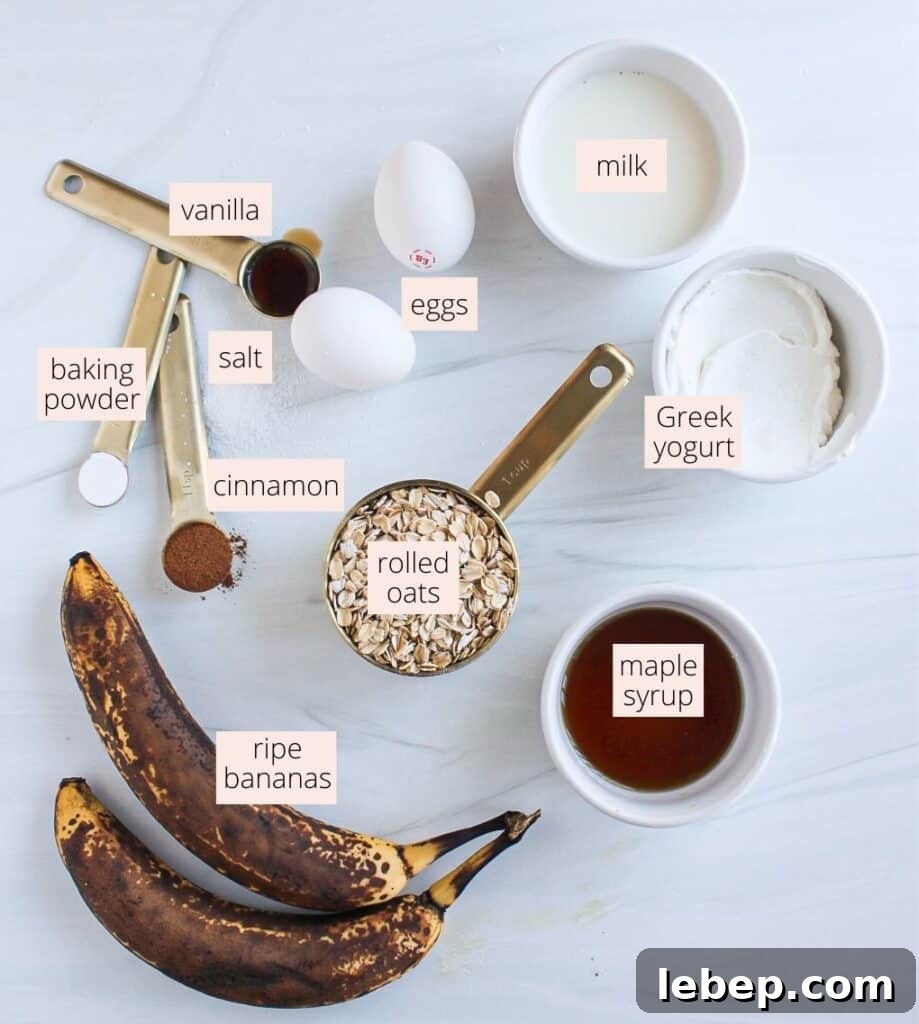 Cinnamon Roll Baked Oatmeal — Morning Bake with Creamy Glaze 3 Bananas, oats, eggs, vanilla, maple syrup, cinnamon, baking powder and salt on a countertop with labels.