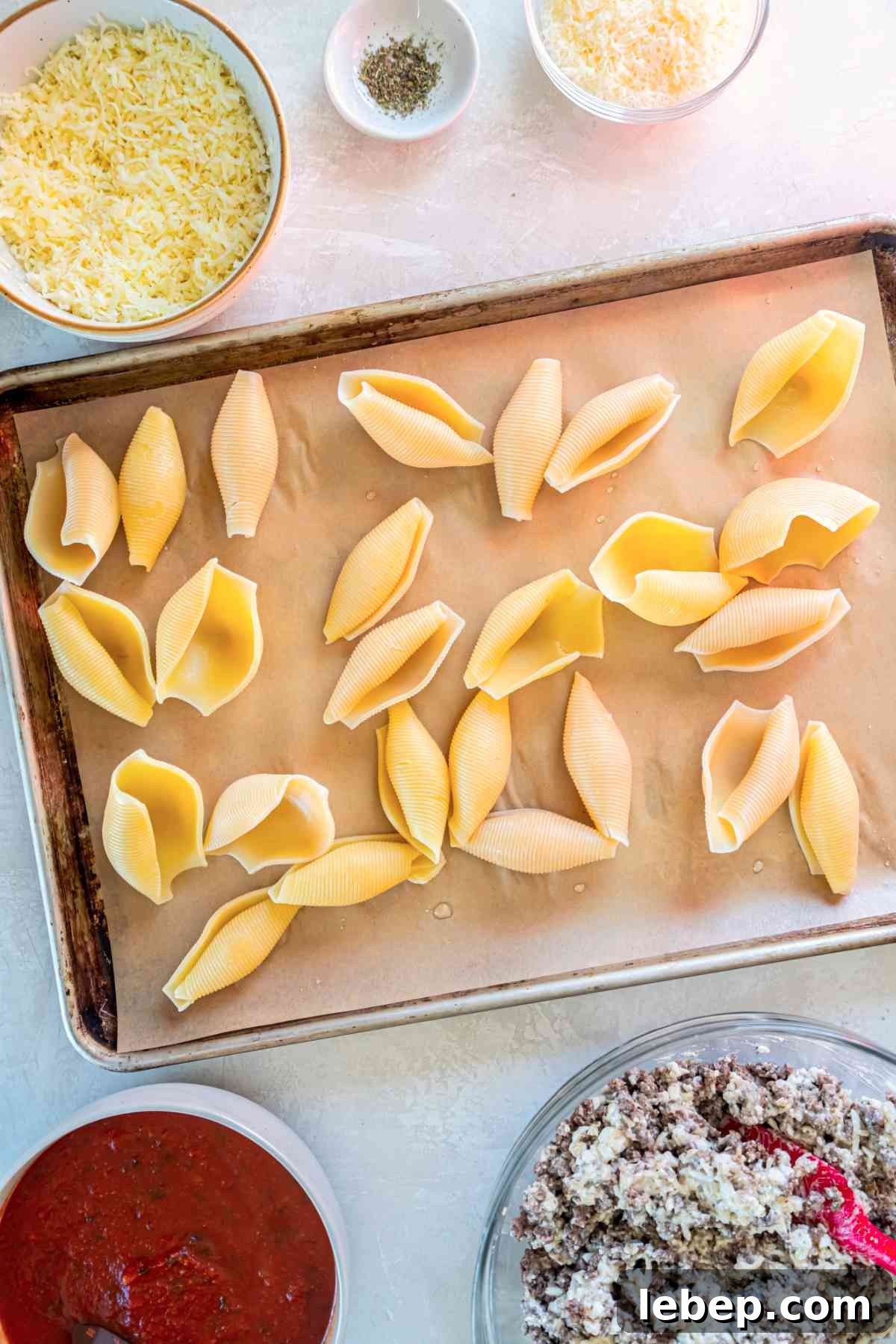 Baked Stuffed Shells with Beef and Cottage Cheese Filling 4 Cooked jumbo pasta shells spread on a baking sheet to cool before stuffing