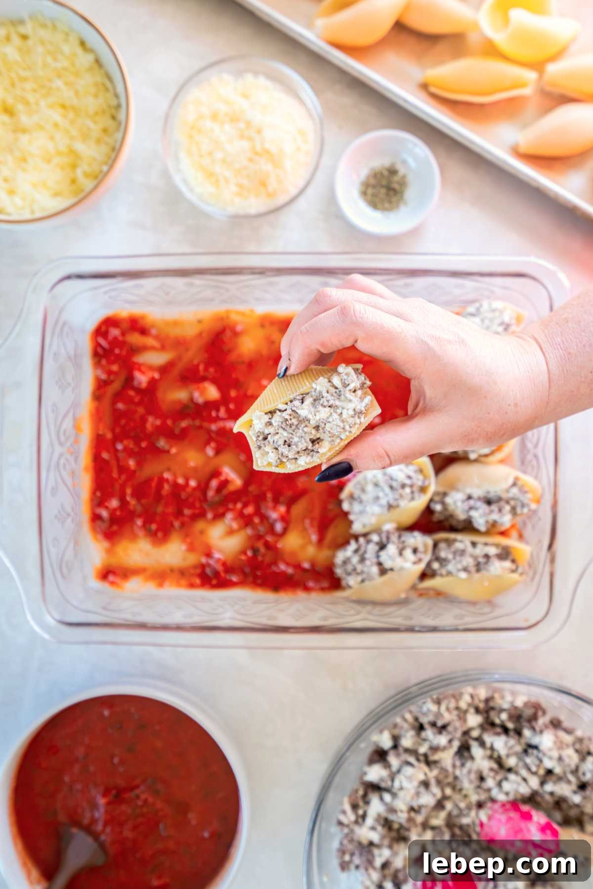 Baked Stuffed Shells with Beef and Cottage Cheese Filling 8 Hand filling jumbo pasta shells with ground beef and cottage cheese mixture