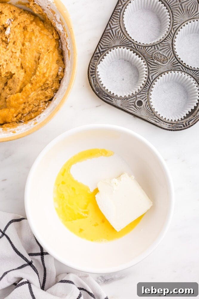 Fluffy Pumpkin Muffins with Cream Cheese Swirl 6 picture of butter and sugar being mixed in a bowl