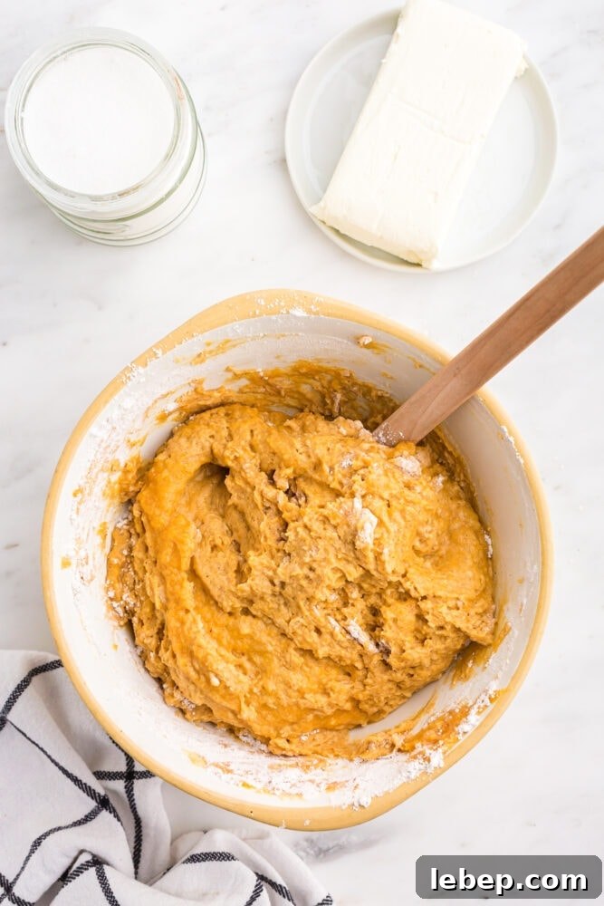 Fluffy Pumpkin Muffins with Cream Cheese Swirl 10 picture of pumpkin batter in a bowl