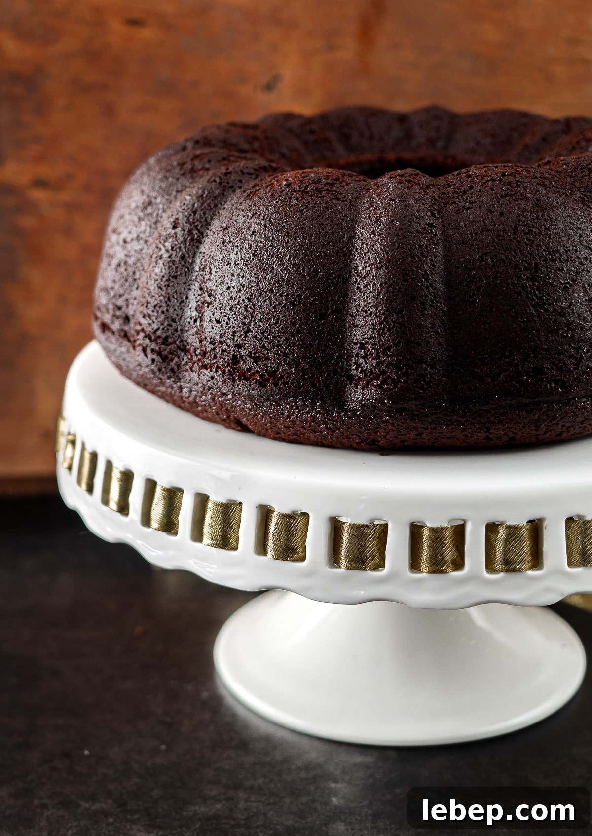 Rich Chocolate Stout Bundt Cake Recipe for Moist Decadence 3 Chocolate stout bundt cake on cake stand.