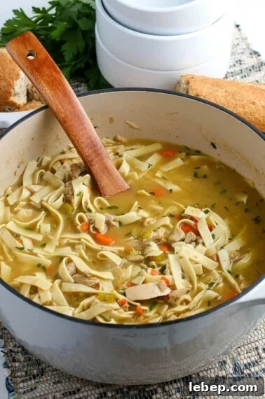 Comfortable Turkey Pot Pie Recipe with Flaky Crust 7 leftover turkey soup in a dutch oven with a wooden soup