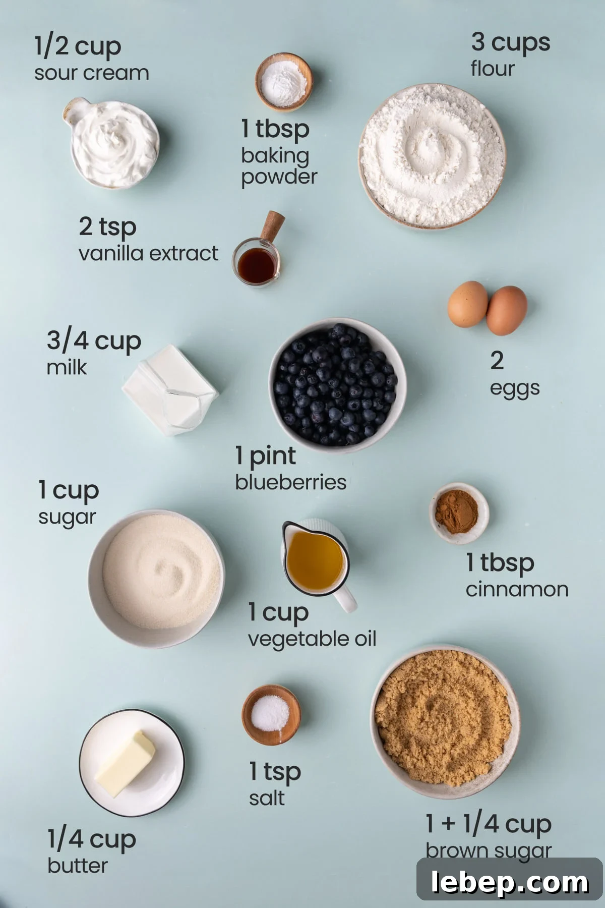 Moist Blueberry Sour Cream Coffee Cake Recipe for Brunch 3 All the ingredients you need for blueberry sour cream cake including baking powder, sour cream, flour, vanilla extract, milk, eggs, fresh blueberries, granulated sugar, oil, cinnamon, light brown sugar, and butter.