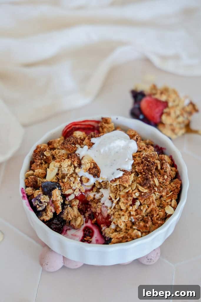 A bite out of a berry breakfast crumble.