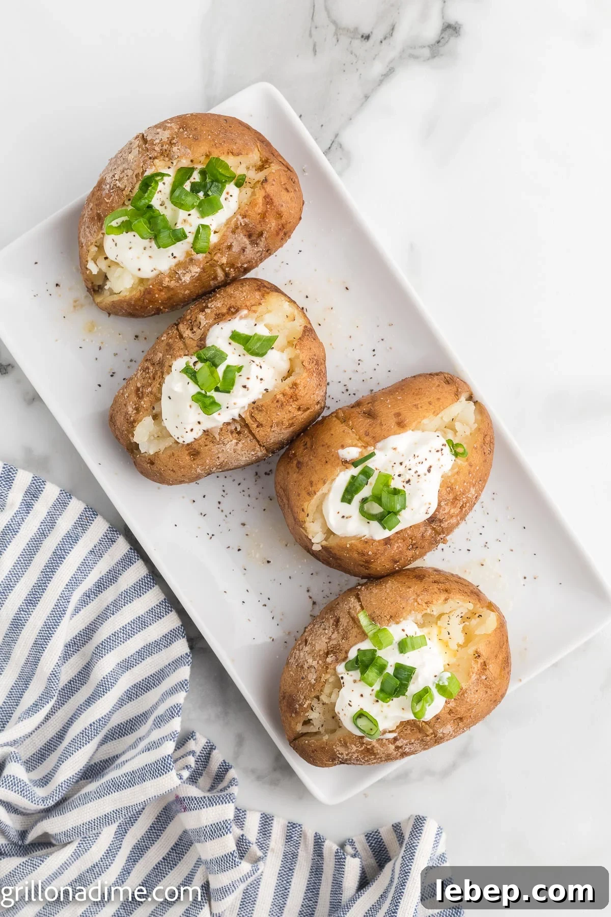Smoked Baked Potatoes Recipe: Crispy Skin, Smoky Flavor 9 Smoked baked potato topped with sour cream and chives