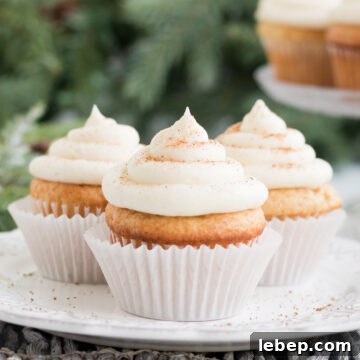picture of three egg nog cupcakes on white plate