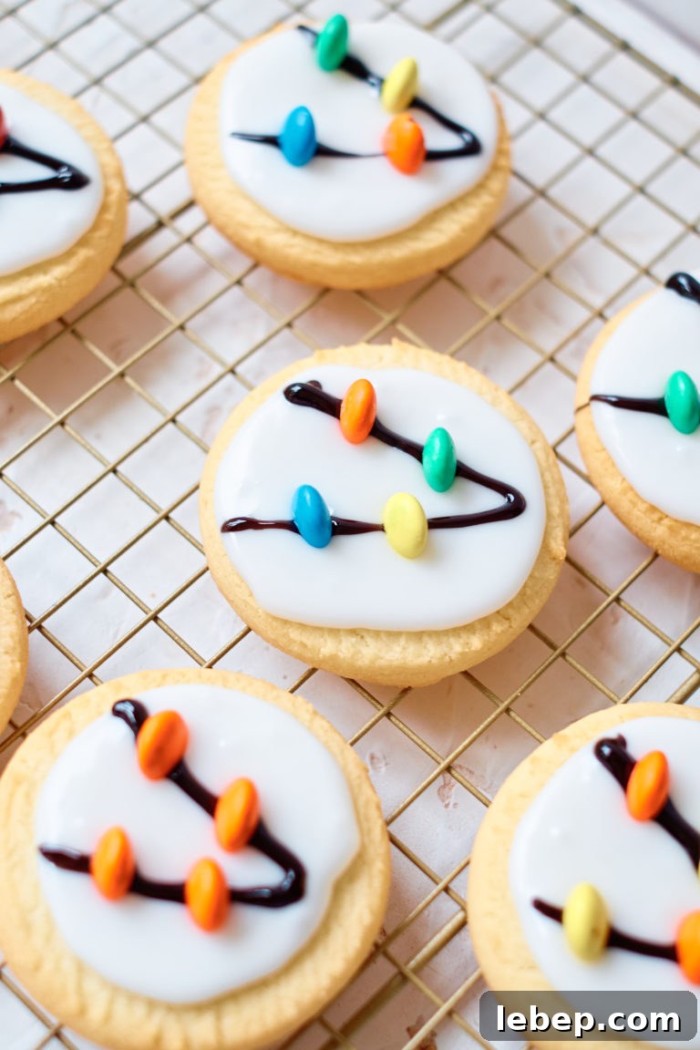 Christmas Light Sugar Cookies: Festive Decorating Tips & Recipe 5 top down view of the decorated cookies on a cooling rack