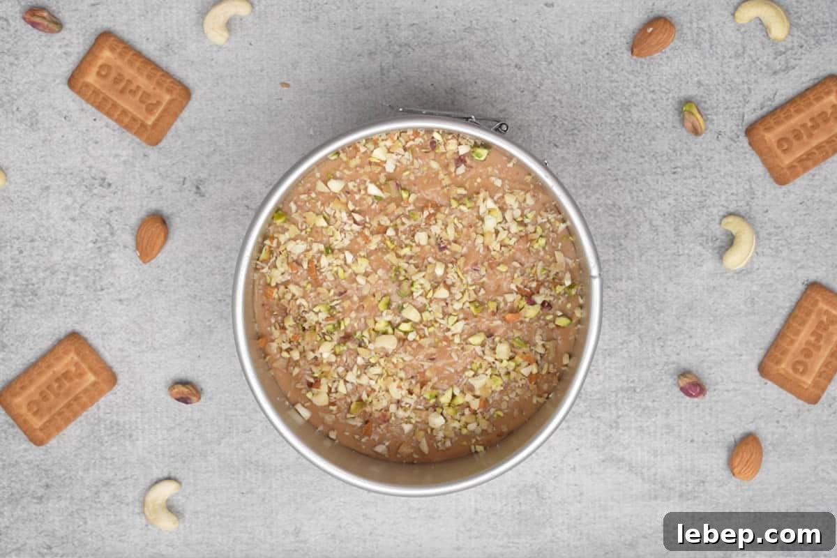 Batter topped with chopped nuts.