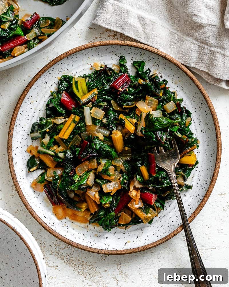completed Sautéed Swiss Chard [with Garlic] plated on a white plate