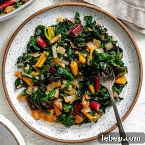 completed Sautéed Swiss Chard [with Garlic] plated on a white plate
