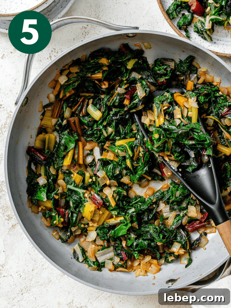process shot of Sautéed Swiss Chard [with Garlic] cooking in pan