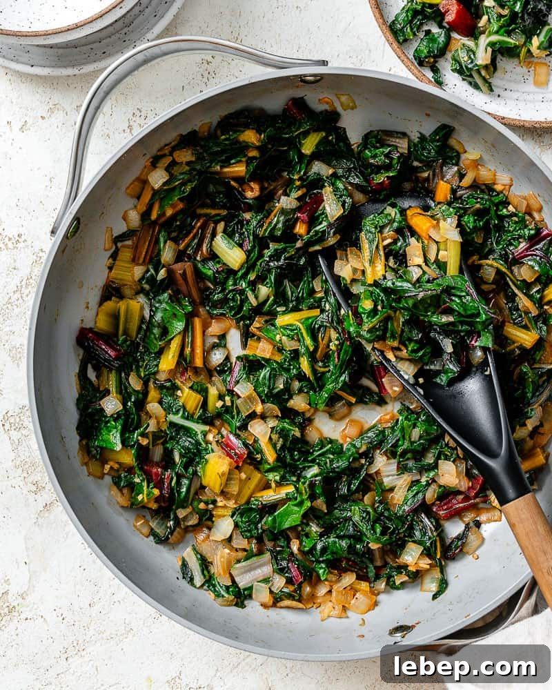 completed Sautéed Swiss Chard [with Garlic] plated on a white plate