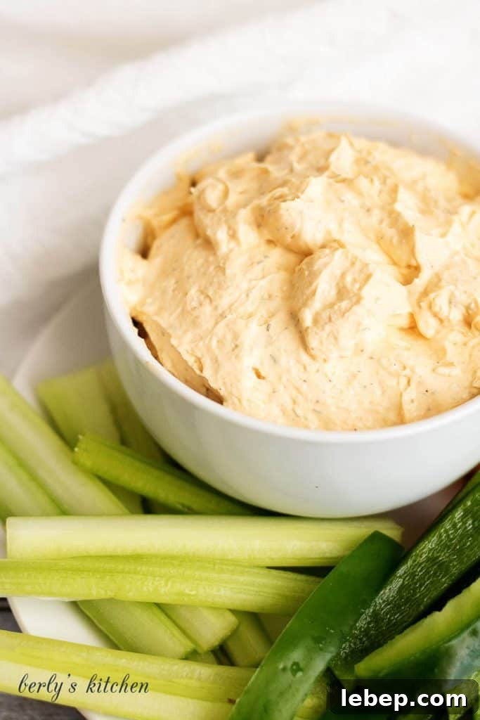 Creamy Buffalo Chicken Dip Recipe for Parties and Game Day 4 Buffalo spread in a white bowl.