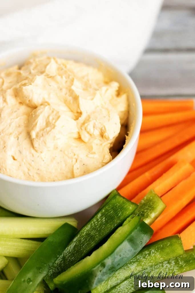 Creamy Buffalo Chicken Dip Recipe for Parties and Game Day 6 A creamy buffalo cheese spread made with cream cheese, hot sauce, and sour cream. It's the perfect spicy spread for crackers and vegetables.