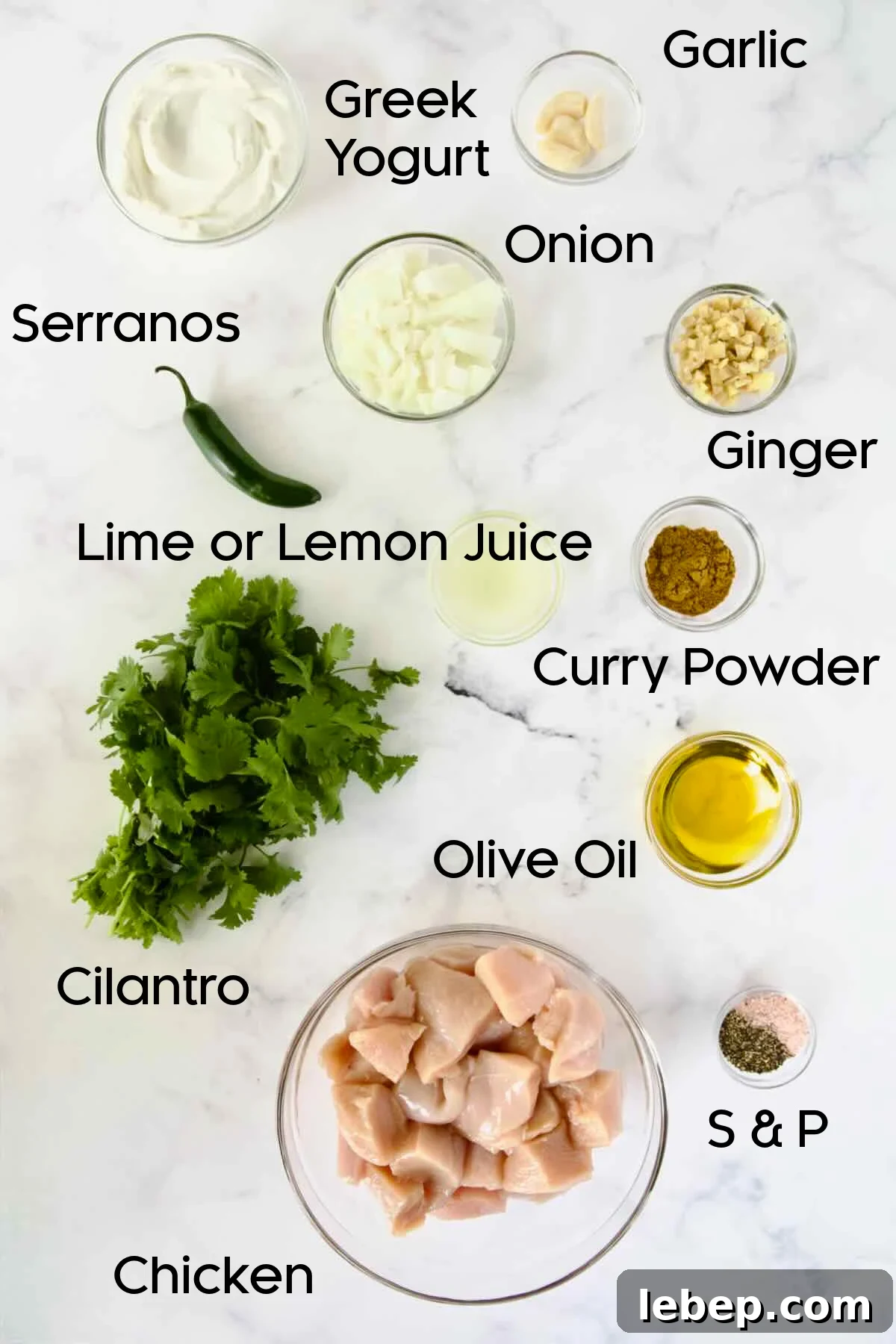 Ingredients for Yogurt Marinated Grilled Chicken Skewers in glass bowls.