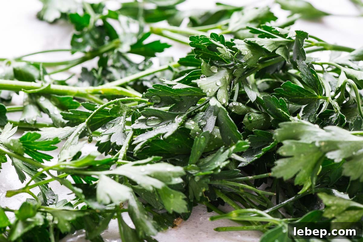 Drying Parsley in the Oven: Quick Guide for Flavorful Dried Herbs 4 A macro close-up shot of wet parsley with drops of water.
