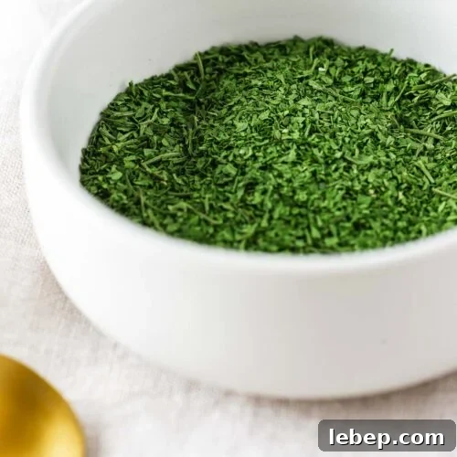 Drying Parsley in the Oven: Quick Guide for Flavorful Dried Herbs 10 A small white ceramic bowl with oven dried parsley.