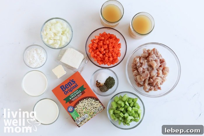Creamy Slow Cooker Wild Rice and Chicken Soup Recipe 4 Ingredients for creamy chicken and wild rice soup laid out on a kitchen counter