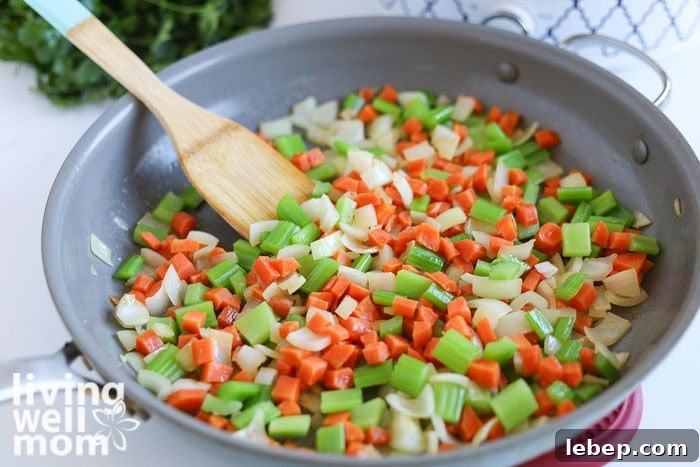 Creamy Slow Cooker Wild Rice and Chicken Soup Recipe 5 Sautéing onion, carrots, and celery in butter before adding to the crockpot