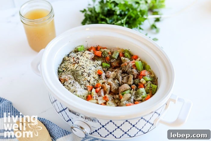 Creamy Slow Cooker Wild Rice and Chicken Soup Recipe 6 Chicken and veggies cooking in a crockpot