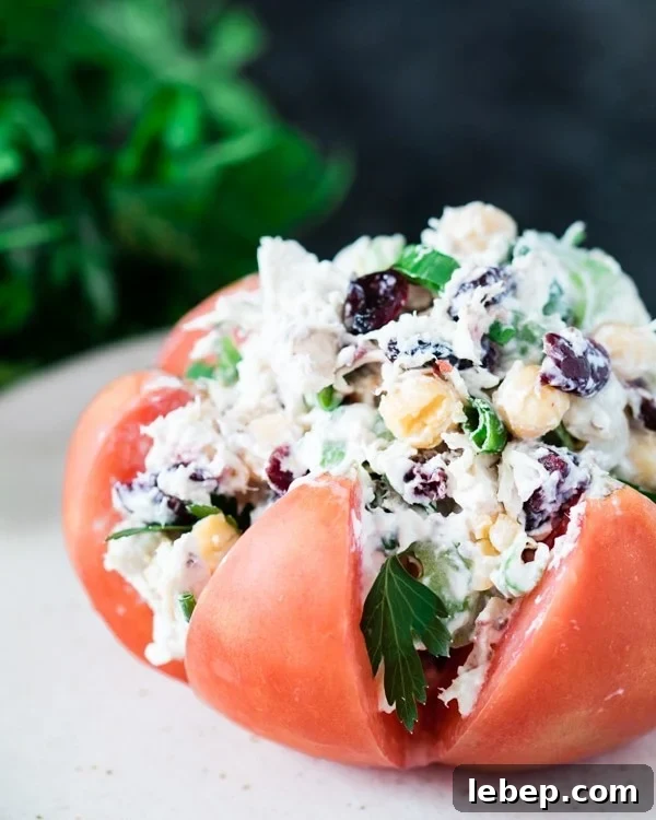 Chicken salad stuffed inside of a heirloom tomato.