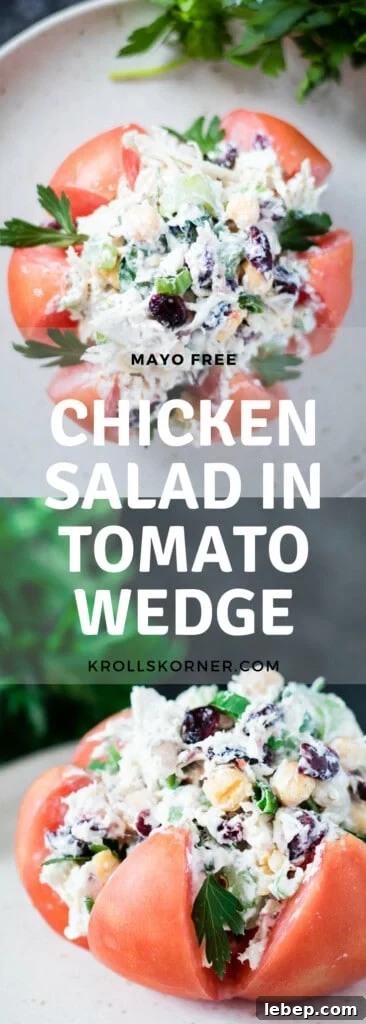 Greek Yogurt Chicken Salad Served in Tomato Wedges 5 Chicken salad stuffed inside of a heirloom tomato on a plate garnished with parsley