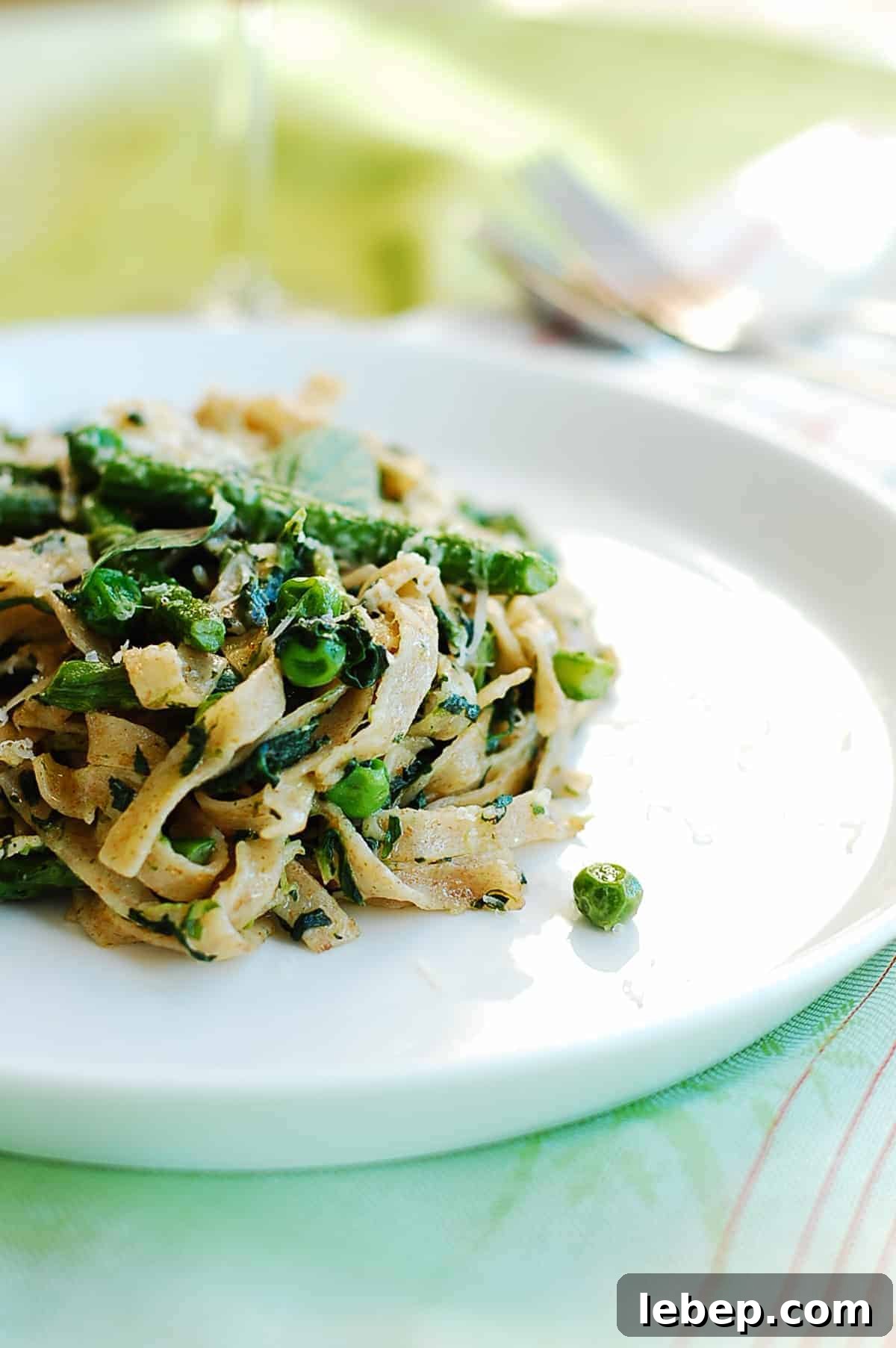a serve of pasta tossed with greens