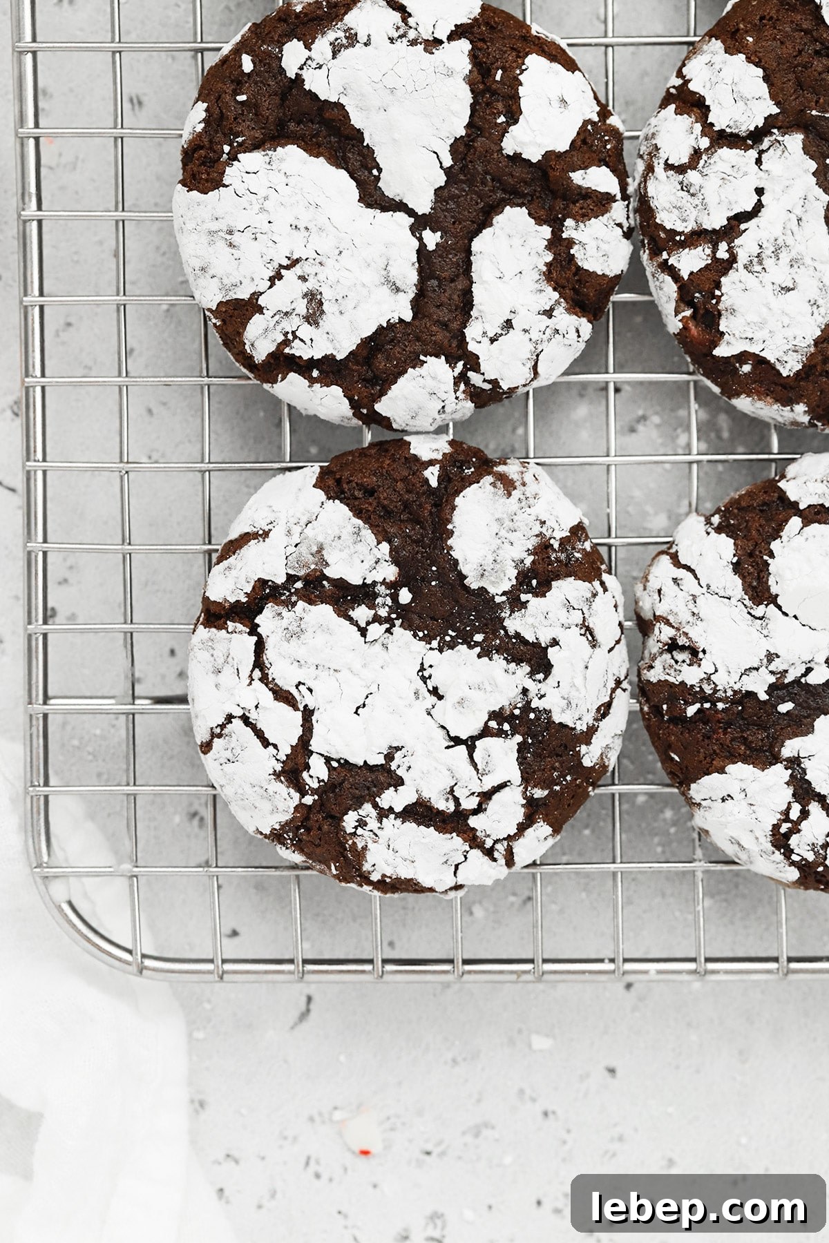 Gluten-Free Peppermint Chocolate Crinkle Cookies Recipe 15 Overhead view of gluten-free peppermint chocolate crinkle cookies on a cooling rack