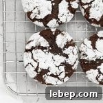 Overhead view of gluten-free peppermint chocolate crinkle cookies on a cooling rack