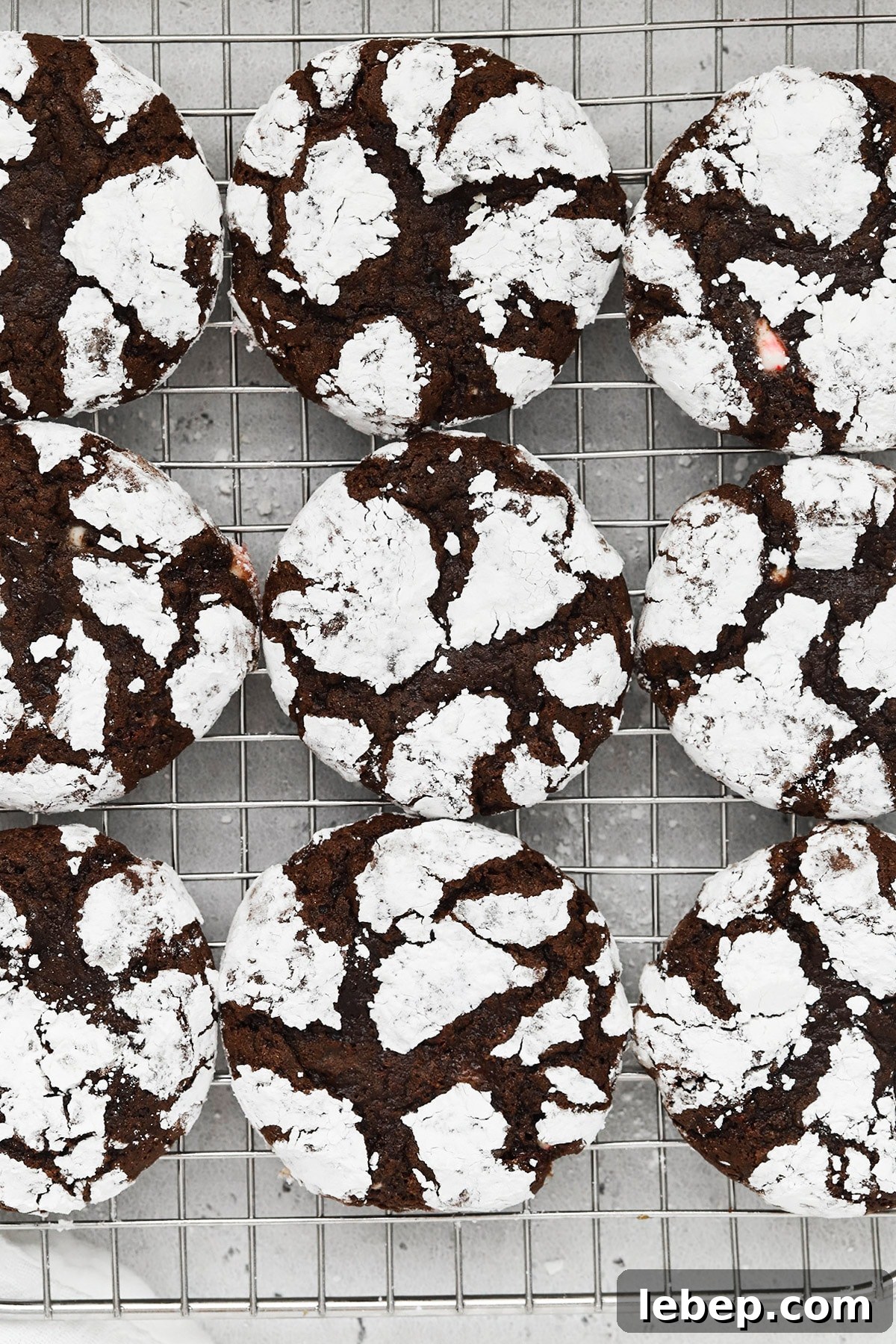 Gluten-Free Peppermint Chocolate Crinkle Cookies Recipe 10 Overhead view of gluten-free peppermint chocolate crinkle cookies on a cooling rack