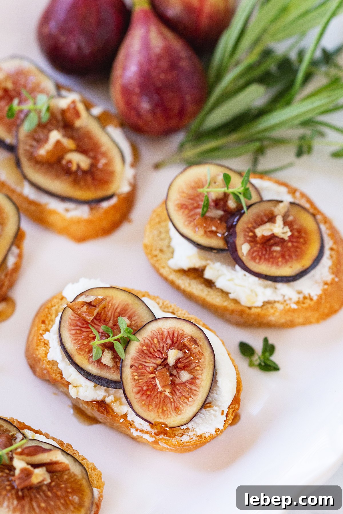 Fig and Goat Cheese Crostini with Honey and Chopped Pecans