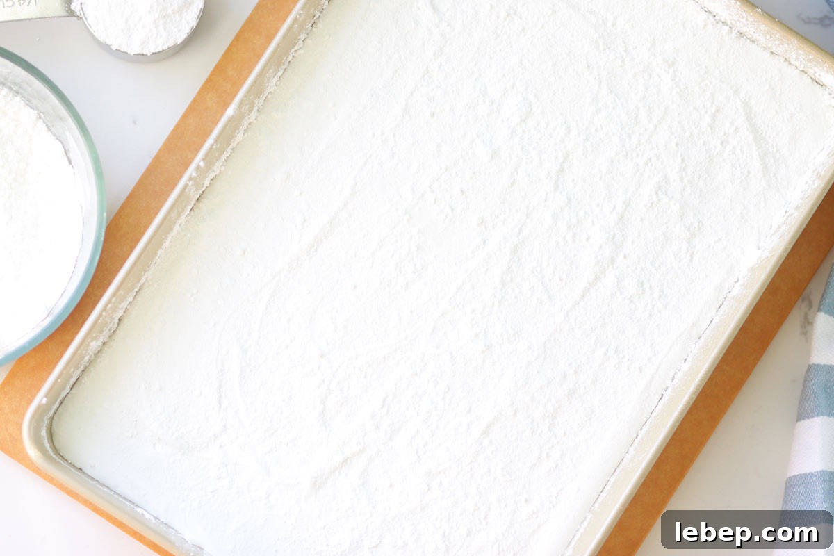 Homemade Marshmallows Without Corn Syrup: Simple Recipe 4 a pan of marshmallows that haven't been cut into squares yet