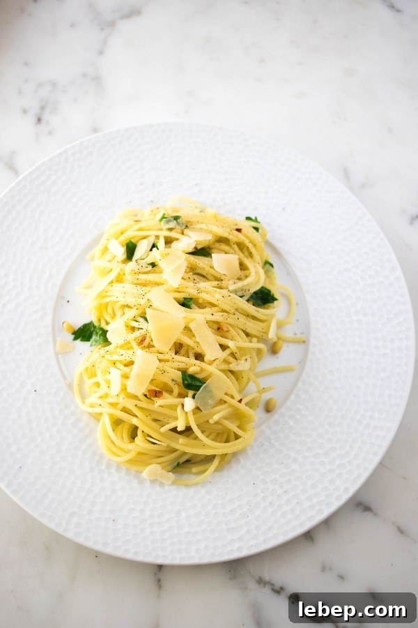 spaghetti with garlic and olive oil topped with parmesan and parsley