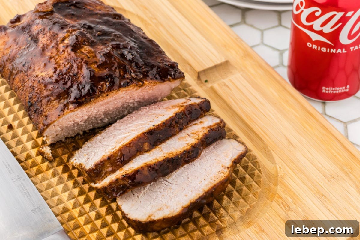 Finished pork loin on a cutting board.