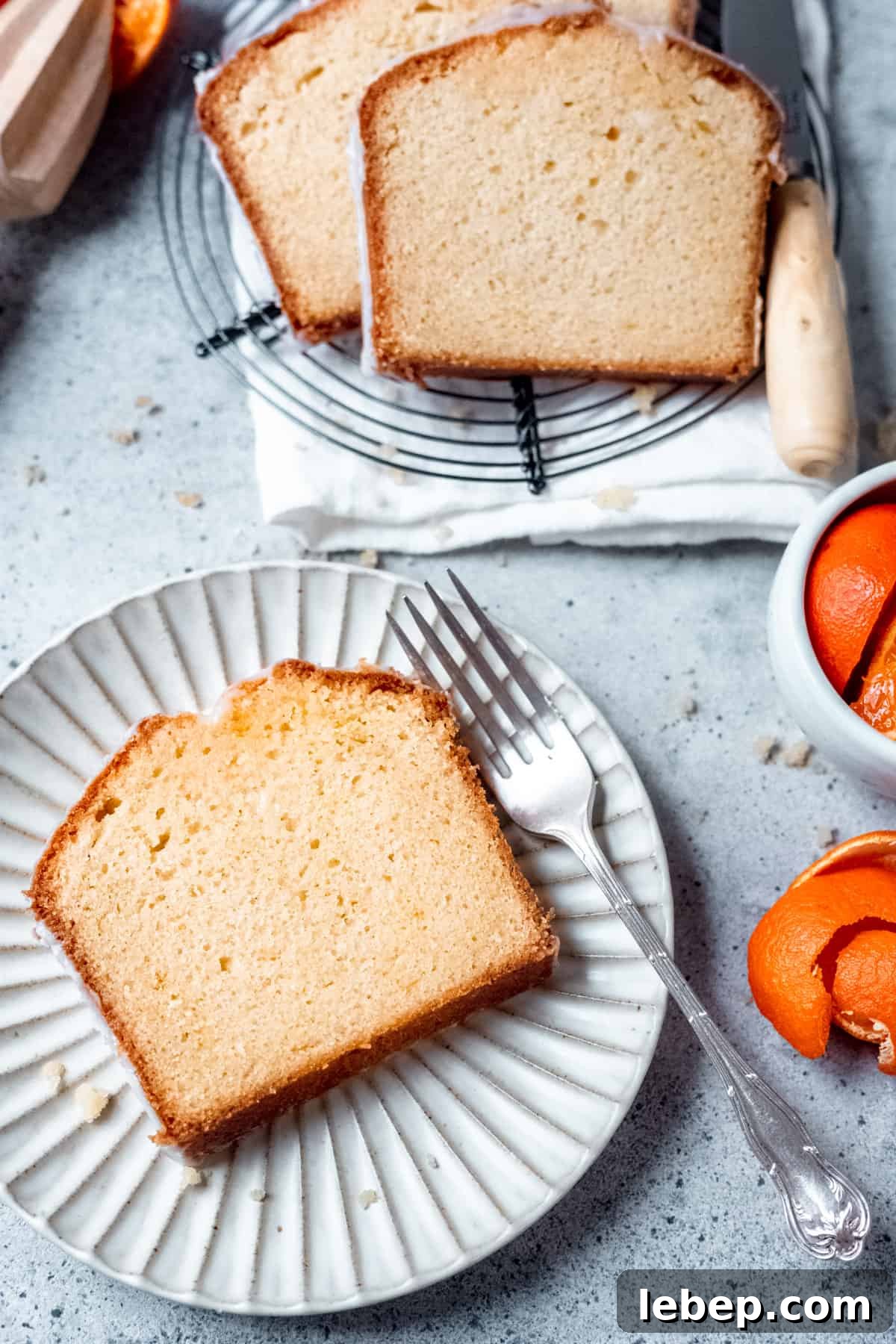 Orange Drizzle Cake Recipe with Zesty Glaze 2 orange drizzle cake on a plate