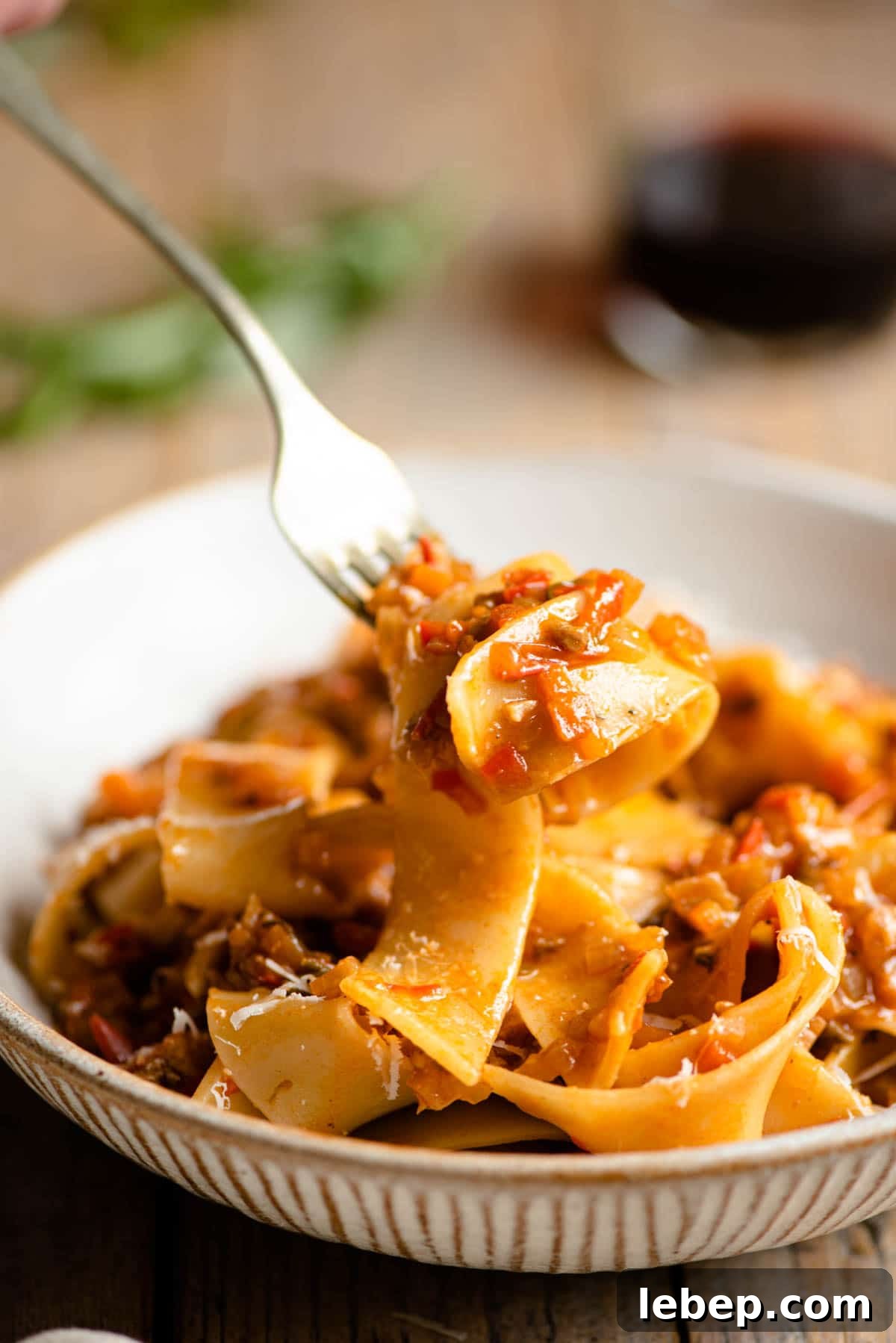 Hearty Vegetable Ragu with Pappardelle Pasta Recipe 6 A close up of a forkful of pasta with vegetable sauce