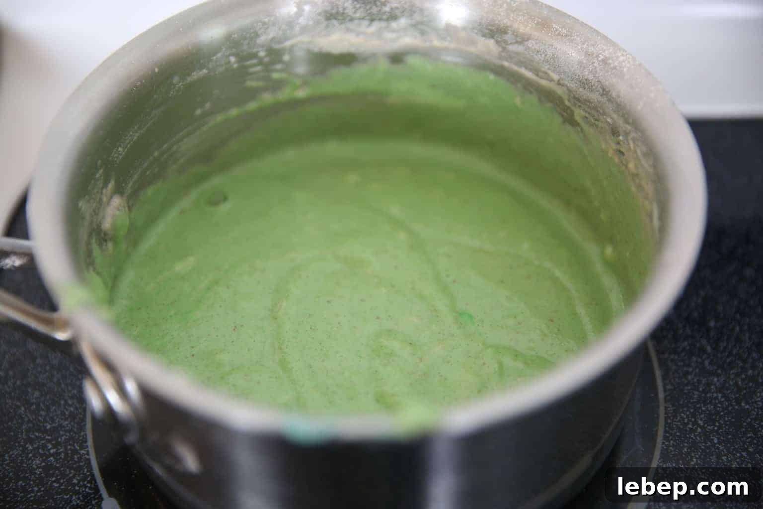 Aromatic Homemade Play Dough Recipe for Calming Sensory Play 4 heating up ingredients for diy playdough in metal pot