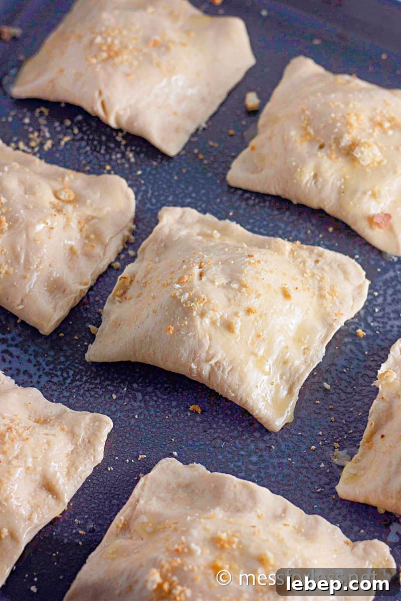 Cheesy Chicken Crescent Bake with Puff Pastry Squares 11 crescent square with crushed crutons sprinkled on top