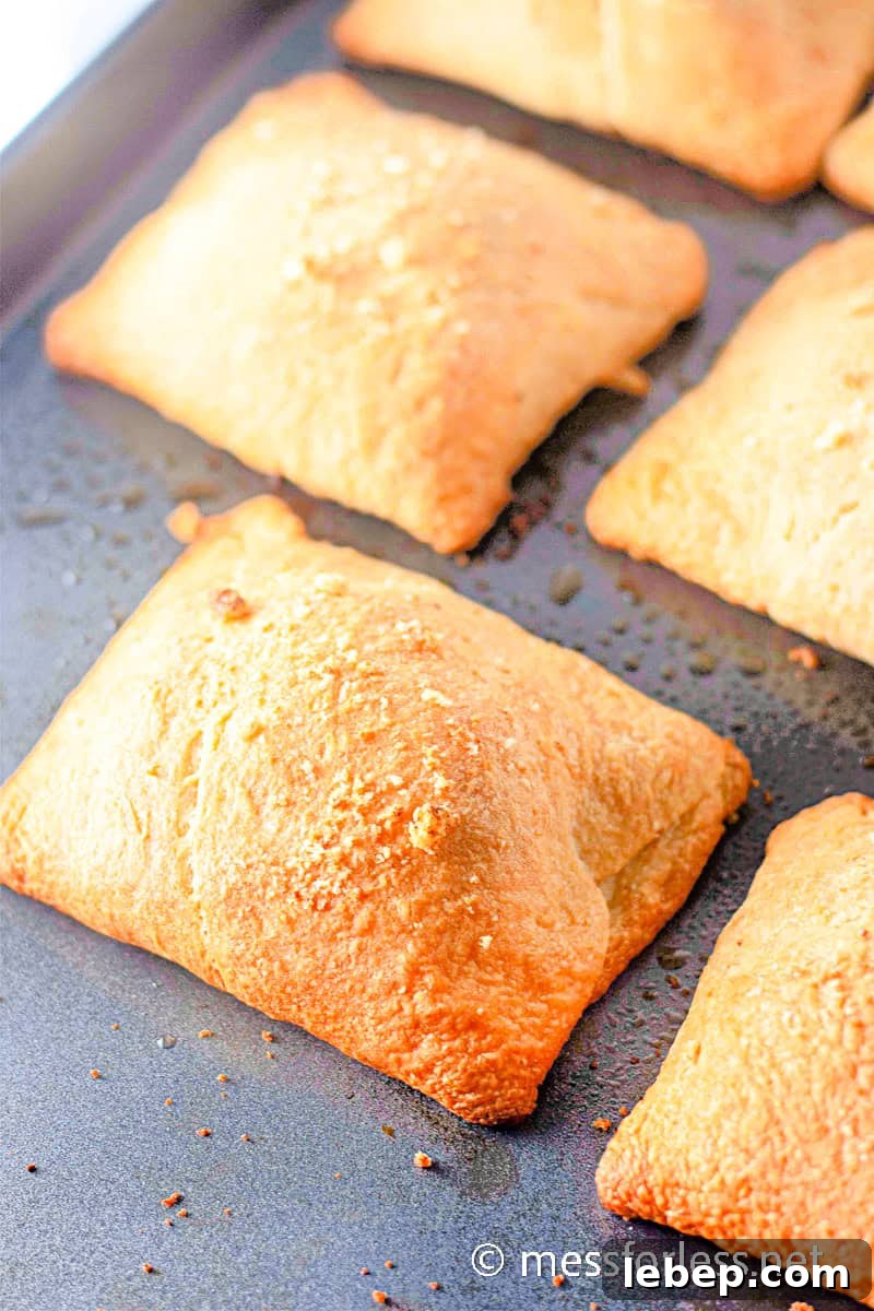 Cheesy Chicken Crescent Bake with Puff Pastry Squares 12 Chicken Crescent Squares on baking sheet