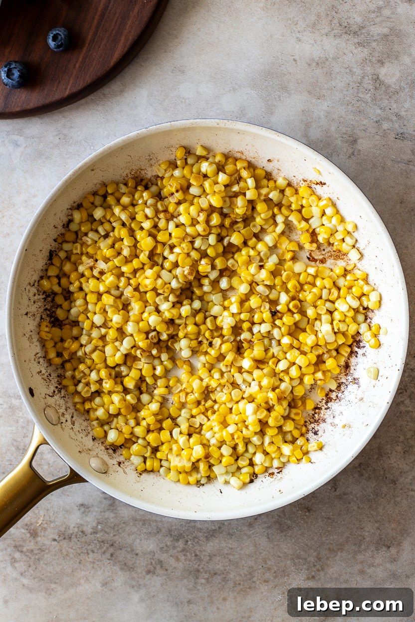 Overhead photo of a skillet of cooked corn