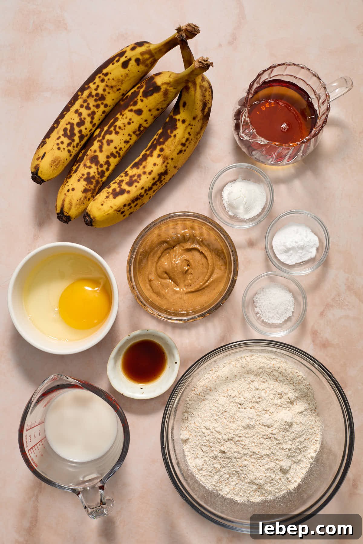Spelt Flour Peanut Butter Banana Muffins — Naturally Sweetened 3 Ingredients to make spelt flour banana muffins arranged individually.