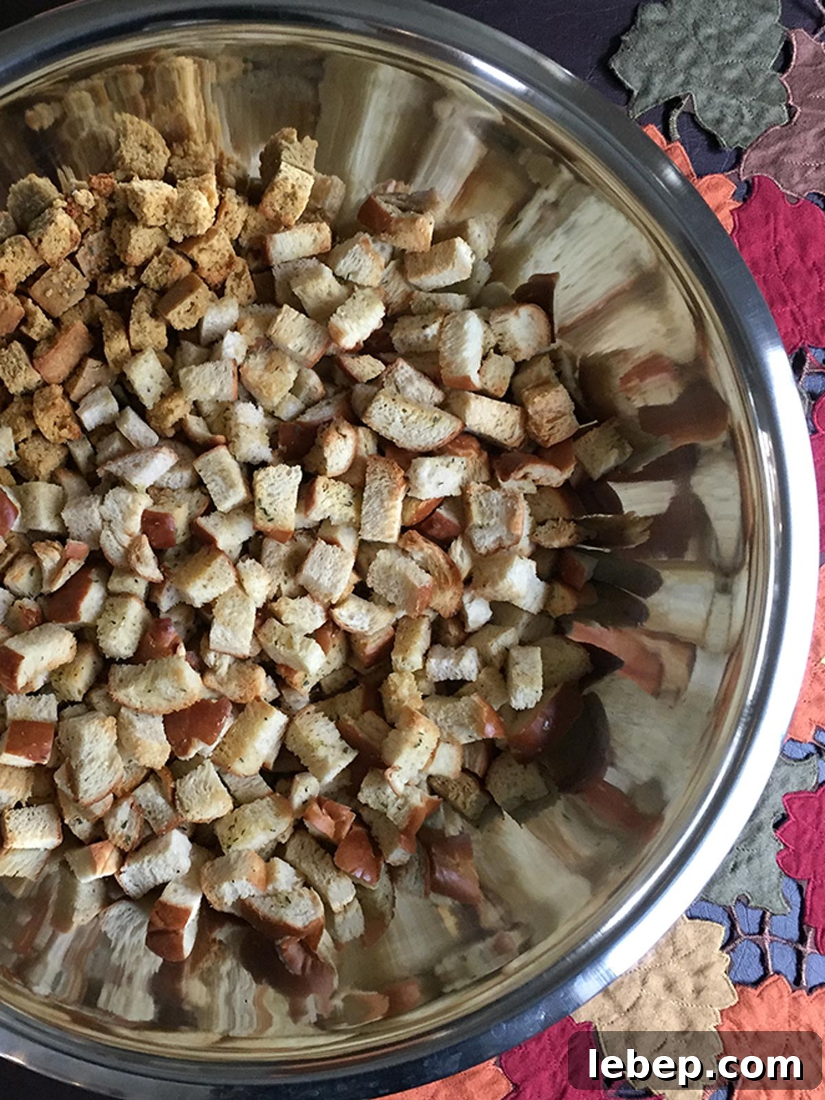 Sage Sausage Stuffing Recipe for Thanksgiving and Holiday Dinners 6 Stuffing bread cubes in large stainless steel bowl.