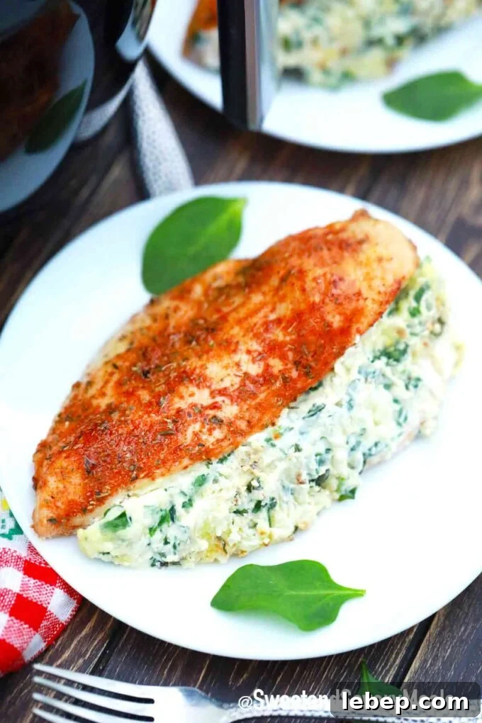 air fried stuffed chicken breast with a creamy spinach filling on a plate