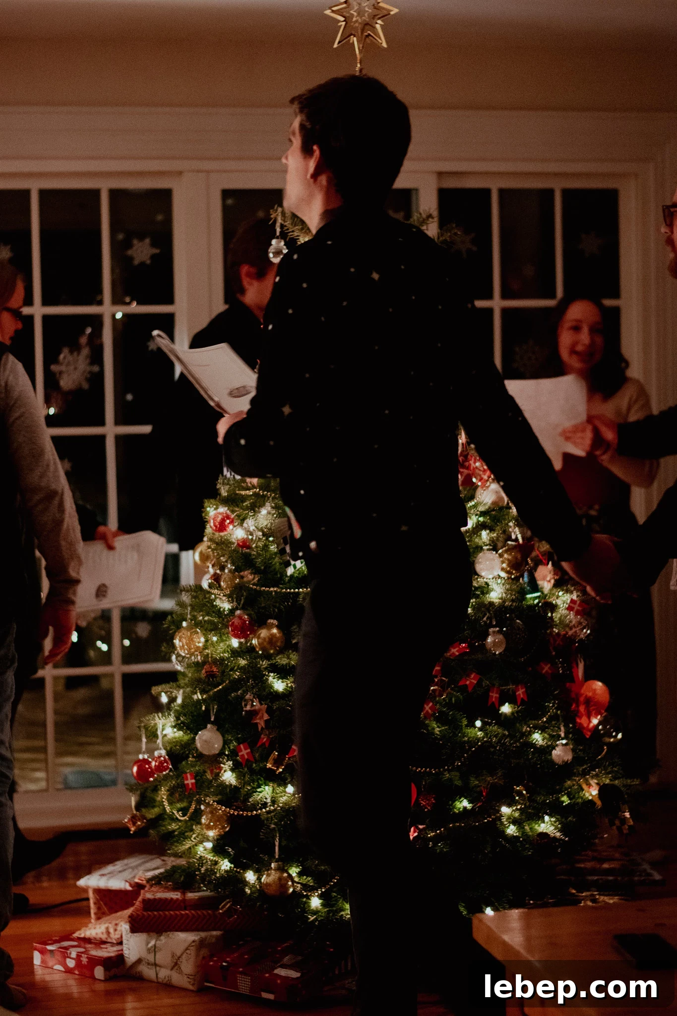 Dancing around the Christmas tree.